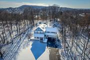 This Modern Farmhouse located at The Farm in Nyack is nestled into the mountainside on 2.47 acres. Drive down a private driveway and discover unparalleled luxury and style in this custom built home which spared no expense using the finest materials , designers,  craftsmen and attention to detail. Equidistant to both Hook Mtn and the center of the Village it is minutes to downtown Nyack, yet it is surrounded by birdsong and nature. The open design floor plan features Cathedral ceilings, exposed beams, and french doors which open onto a wide wraparound porch. The Chef&rsquo;s kitchen is complete with custom cabinets, separate prep area with a second sink,  a Bertazzoni Range, a massive soapstone island, a full size wine fridge and double dishwashers. Other features include a separate wing perfect for an in-law /guest suite (barrier free accessible ) or home office. This home provides the perfect environment for entertaining both indoors or out - with a large beautiful dining room, living room and an in ground pool with soft southern light exposures, hot tub and half basketball court. The natural stone hearth with an energy efficient wood burning stove and the radiant heat wide plank h/d floors will keep you warm and cosy in winter. The primary bedroom is complete with a gas fireplace, sitting area and uber custom closets. 5 bdrs, 3 1/2 baths , 2 cozy reading nooks,  basement bonus space plus great attic options as well. This location is perfect for a primary residence or as a weekend retreat located only 30 miles into Midtown Manhattan . Never lose power with a whole house gas powered generator. Surrounded by well thought out landscaping and mature plantings.