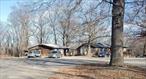 Many possibilities for this sprawling multi-family complex on 42 plus rolling acres. Great privacy, convenient location, partial mountain and nature views, two ponds. Keep and update the multifamily units for income and subdivide the remaining acreage, or remake this into your own family compound or estate, or â€¦ lot of possible scenarios. Some repairs are needed; property is sold as-is. Mostly forested with some old growth trees, open areas have potential for agricultural use. This was formerly a family care facility, with three main buildings and large workshop garage. Abuts Greenfields Park development with primary access. Secondary access to South Quaker Lane. See attached apartment roster for breakdown and more info on units.