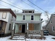 Old style 2+ Story home with some original woodwork on side street in village setting. Full basement, stand up attic, covered front and rear porch, storage shed in rear with small yard. Needs complete rehab but worth the effort!