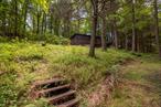 Magical Woodland Escape! This enchanting property feels worlds away yet is conveniently close to everything. With stunning rock outcroppings, a sparkling stream, and pristine forest, the land is pure magic. Endless potentialâ€” start fresh and build your dream home. Please note: the existing structure is likely a teardown, offering a rare opportunity to reimagine the space entirely.Nearby, enjoy incredible hiking trails like John Burroughs Sanctuary and Shaupeneak Ridge Park, all while being just 18 minutes from New Paltz, Kingston, and Poughkeepsie. Located in the coveted New Paltz school district, the property also features a well and septic (condition unknown). Donâ€™t miss this serene and versatile gemâ€”being sold as is.