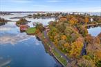 Rare waterfront opportunity offering both sunrise, sunset and a protected deep water dock! Enjoy panoramic vistas providing an incredible array of breathtaking water views. Perfectly situated, protected, bucolic 2.58 acres of natural beauty and over 200 feet of direct harbor waterfront. Whether you choose to renovate, build anew or pursue subdivision potential, explore the optionality. Site plan and surveys offer inspiration for potential subdivision or secure the perfect family compound close to all. Protected deep water dock that can handle multiple boats as well as existing marina offering 50 slips, only a 5 minute boat ride to the L.I. Sound. Enjoy a vacation lifestyle year round only 35 miles to Midtown, 5 minutes by car to town, train and all major highways. Unleash the value of this coveted location Where else can you experience a prime waterfront location with the opportunity to create your own dream home? Unique, like no other.