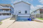 Welcome to this incredible two-family duplex in the heart of Long Beach! Perfect for investors or those looking to expand their portfolio, this property offers not one but two spacious units, each with its own unique features. Both units are duplexes, boasting 3 generously sized bedrooms and 1.5 bathrooms each. Tenants enjoy independence with separate gas and electric meters, boilers, and water heaters, ensuring hassle-free management. One unit features sliding doors leading to a deck and a large fenced-in backyard, perfect for outdoor enjoyment.The property includes an unfinished basement, offering endless possibilities for storage or future customization. Property is being sold with paying tenants already in place, providing immediate rental income. Don&rsquo;t miss this rare opportunity to own a well-maintained investment property in a prime location! Contact us today to schedule a showing and make this property the newest addition to your portfolio.