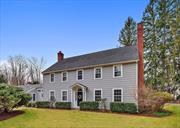 Location Location Location - Katonah village at your disposal! Once known to be an old carriage house, this colonial style farmhouse is the Best of Both Worlds!!! This home is set back off of Cherry Street and within walking distance to the train, town and highways but in a neighborhood setting. Offering new updates, with all the old charm. Boasting high ceilings, a large eat in kitchen with quartz countertops, built-ins and a mudroom. Other features are a whole house generator, central a/c, beautiful windows with great light, walk up attic with cedar closet, mud room, 2 car garage, oversized back deck, front and back patios and hardwood floors throughout, a 1st floor bedroom with a full bathroom and updated kitchen with quartz countertops. Generous hallways and room sizes keeps the flow of this home open and elegant and yet cozy. A must see!!!