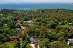Discover your ideal Hamptons retreat in Southampton.This well-maintained 6-bedroom, 6-bathroom home offers a spacious, open layout with modern renovations (2021). The sunlit first level features a living and dining area adjacent to an eat-in kitchen, along with a junior primary suite, two additional bedrooms, and a full hall bath. Upstairs, you&rsquo;ll find the primary suite, an office, and two guest bedrooms-one ensuite and one with a dedicated hall bath. The finished lower level includes a kitchenette, living room, full bathroom, and direct access to the 2-car garage. Outside, enjoy a heated pool, hot tub, outdoor shower, grill area, basketball hoop, and more. Conveniently located near Southampton Village and Hampton Bays, this home offers the best of Hamptons living.