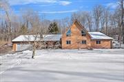 Welcome to this open, bright and spacious contemporary ranch on the top of a hill overlooking the mountains. On a clear day....WOW the views here are incredible.  This house is special with an Adirondack feel and high-quality construction including soaring ceilings, exposed beams, open floor plan and more. The living room features a wall of windows and a stone fireplace with a thermostat regulated pellet stove, wood floors and beautiful built-ins. The kitchen is updated and features stainless steel appliances. One floor living is luxurious and convenient with everything you need easily accessible to you.  Enjoy an oversized primary bedroom with renovated bathroom, jacuzzi tub and stand-up shower. Perhaps one of the greatest features of this home is the spacious loft which can be used as a play room, gym, studio, office, lounge, game room and more. The property consists of 12 acres wonderful for trail blazing, hiking, hunting and simply having your own, private, sprawling, wooded land. Close to major shopping and restaurants. Easy NYC commute by car, bus or train. Enjoy! And hurry...this won&rsquo;t last.