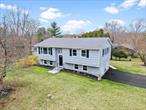 NEWLY RENOVATED AND MOVE IN READY!!! Discover this beautifully updated 3-bedroom, 2-bathroom Raised Ranch home, ideally situated in the heart of the Town of Wallkill and within the highly sought-after Wallkill School District. This charming home offers a prime location just minutes from Route 32, providing easy access to the Town of Plattekill, where youâ€™ll find an array of dining options, shopping centers, and local conveniences. Nature lovers and outdoor enthusiasts will appreciate the proximity to Minnewaska State Park Preserve, scenic Hudson River cruises, and the vibrant arts scene at The Mark Gruber Gallery. Plus, enjoy nearby parks and fresh local produce from nearby farms. The location is just the beginningâ€”this stunning home is packed with features youâ€™ll love! Step into the beautifully designed kitchen, showcasing rich wood cabinetry, sleek stainless steel appliances, gleaming granite countertops, and a stylish subway tile backsplash that enhances its contemporary charm. Adjacent to the kitchen, the bright and inviting dining area boasts elegant pendant lighting and sliding glass doors that lead to a spacious deck. The expansive living room features large windows that flood the space with natural light, complete with oak hardwood flooring throughout. This home offers three generously sized bedrooms with ample closet space and a fully updated modern bathroom. Downstairs, the lower level presents a cozy family room with a decorative fireplace, durable laminate hardwood flooring, a full bathroom with a shower stall, and a dedicated utility room that doubles as a private laundry area. The exterior is just as impressive, featuring a two-car attached garage, additional driveway parking, and extra storage space in the wood-framed shed. This home will not last long on the market, don&rsquo;t delay, call now for your showing!!!