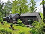 Nestled in a serene, wooded setting, 326 Pratt Hill Road is a thoughtfully designed Cape-style home that blends rustic charm with modern comforts. Originally a quaint cabin, it has been carefully expanded over the years and now offers three bedrooms, two full bathrooms, and 8.1 private acres â€“ perfect for a weekend escape or year-round living. The oversized living area features hardwood floors, a wood-burning stove, and a sunlit bay window. A well-appointed kitchen boasts stainless steel appliances, granite countertops, and a gas fireplace with a beautiful stone surround. A bar area, situated off the kitchen, opens onto a wraparound stone patio, and the separate dining room also opens to the outdoor space, offering scenic views year-round. The spacious primary suite includes vaulted 19-foot ceilings, an additional gas fireplace, an en-suite bath, a bright walk-in closet, and its own private patio access. A cozy second bedroom sits above the kitchen area via a spiral staircase, while a flexible third bedroom currently serves as a home office. A second full bath provides convenience for guests. The expansive patio overlooks mature pines and curated gardens, creating a picturesque backdrop for outdoor gatherings. It even includes an outdoor shower. An attached, extra-deep two-car garage offers bonus storage space and a convenient entrance into a lower-level laundry/mudroom. Central air-conditioning rounds out the modern conveniences of this idyllic country home. Centrally located, the property is just 12 minutes from the Village of Chatham and 7 minutes to Harlemville and the Hawthorne Valley Farm Store, with easy access to Ghent, Hudsonâ€™s Amtrak station, and the Taconic State Parkway for a seamless NYC or Berkshires commute. Come experience the seclusion and charm of 326 Pratt Hill Roadâ€”schedule your visit today!