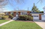 This beautifully renovated brick ranch in Merrick features three bedrooms, two bathrooms, and an open floor plan, complemented by a newly updated kitchen, hardwood floors, a brand new bathroom, and central air conditioning. Additional features include a fully finished basement and a one-car garage.