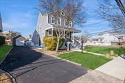 Polished, perfected, and well located! Nothing to do but move right into this fully renovated Colonial with four bedrooms, two full bathrooms, and an oversized, one-car detached garage situated on a landscaped corner lot just minutes to the beach! This home features all new electric, plumbing, windows, siding, roof, doors, and molding, along with an extended blacktop driveway and a new boiler and hot water heater. From the large front porch, step inside to a light and bright interior with beautiful hardwood floors, a cool, neutral color scheme, recessed lighting, and lots of natural light. The foyer opens to a large living room flowing to an open dining area with a sleek gas fireplace. The kitchen is equipped with quartz counters, chic tile backsplash, new stainless steel appliances, and plenty of counter and cabinet space. Off the kitchen there is a pantry and a new full bathroom. A small bonus room could serve as a convenient home office, and the large family room has sliding glass doors to the patio in the large, fully fenced back yard â€“ the perfect setting for warm weather cookouts and gatherings.The second floor encompasses the primary bedroom with a walk-in closet, three additional bedrooms, and a new full hall bathroom. The pristine unfinished basement offers ample storage space and vast possibilities.This home is ideally located close to Jones Beach Inlet, as well as local fishing, parks, waterfront activities, and the Freeport Recreation Center with an outdoor pool, indoor athletic spaces, and an ice-skating rink.