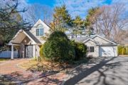 ROSLYN HEIGHTS  COUNTRY CLUB. Located mid-block with all the charm of an enchanting cottage set privately in the woods, this beautifully renovated and expanded Ranch welcomes guests with a graceful brick walk and large gabled front portico. Its open and sprawling floor plan is full of character and offers ample sunny views of its third-acre-plus verdant grounds through a myriad of windows. Gleaming hardwood floors flow throughout, with primary suite on the first floor, along with 2 additional bedrooms, office, rec room, kitchen, breakfast nook, dining room, living room with brick wood burning fireplace, family room with high ceilings and skylights, and a 2nd floor with additional spaces, bedrooms and baths, creates an incredible layout. Additional Features Include: Backyard oasis with built in BBQ, Generator, and more!