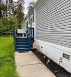 Welcome to this charming 2018 Champion mobile home nestled in the desirable Kinne brook Community. With 1, 568 sq ft of living space, this 3 bed, 2 bath retreat offers a unique country feel that&rsquo;s perfect for those seeking peaceful lifestyle. Step inside to discover a spacious kitchen featuring a convenient island and stylish apron sink. The separate pantry provides ample storage and includes an additional refrigerator for extra convience. Natural light pours in throughout the home, highlighting its beautiful features. The ensuite bathroom is a serene oasis, complete with a large closet and relaxing soaking tub. Additional amenities include a shed on the property and the option to negotiate furniture. Residents of Kinnebrook Community enjoy access to fantastic amenities, including an in-ground pool, dog park, extra parking, and beautifully maintained park areas. The community also takes care of water, septic, snow removal, and trash removal, providing a hassle- free living experience. There is a lease fee involved. With motivated seller, this home is ready for its new owners.
