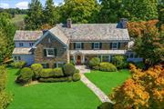 Nestled on a lush half-acre in one of Larchmont&rsquo;s most sought-after cul-de-sacs, this 1931 Moody-built Center Hall Colonial blends historic charm with modern elegance. The stone exterior and timeless architecture are complemented by original details and custom craftsmanship. Upon entering, a grand foyer with soaring two-story ceilings and abundant natural light greets you. Custom millwork, including intricate wood paneling and original archways, adds character and sophistication throughout. The oversized living room is a focal point of the home, featuring custom built-in shelves, a large picture window, a fireplace, and French doors leading to a private back patio for alfresco dining. The private office is ideal for those who work from home, with custom built-ins and direct access to the back patio. The formal dining room features an original built-in bar and a wood-burning fireplace, perfect for intimate dinners or large gatherings. The spacious kitchen combines classic charm with modern functionality. An oversized island provides ample workspace, while top-tier appliances such as the Viking 6-burner and griddle range with double ovens, and Sub-Zero fridge make it a chefâ€™s dream. Custom cabinetry offers plenty of storage, and the adjacent sitting area and family room provide perfect spaces for casual gatherings. Large windows flood the family room with light, creating a welcoming and open environment. A designer&rsquo;s dream bedroom with en-suite bath complete the first floor. Upstairs, the primary suite offers luxury and privacy, with a dedicated hallway full of built-in closets. The private dressing area connects to the primary bath, which features a double vanity, marble counters, radiant heated floors, a soaking tub, and a dual-head spa-like shower. Two additional family bedrooms are well-appointed with custom shelving, built-ins, and en-suite bathrooms with marble vanities and flooring. A large hall walk-in linen closet adds extra convenience and storage. The basement features a cozy den or billiards room with a working stone fireplace, and walk-out access to the yard and the attached 2-car garage. This space is perfect for relaxation or entertaining, with room for movies, games, or gatherings. Ample storage and a laundry space further enhance the basementâ€™s functionality. The private and generous 0.54-acre lot provides space for outdoor activities, gardening, and play. Two bluestone patios complete the yard, ideal for dining, entertaining or relaxing in a beautifully landscaped setting with mature trees. This move-in ready home, combining historic grandeur with modern luxury, offfers an easy 34-minute commute to New York City, walking distance to Murray Ave Elementary School with close proximity to playgrounds, the Leatherstocking Trail, golf courses, and public transportation, all while providing unparalleled comfort and convenience for todayâ€™s lifestyle.