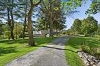 Gracefully sited on almost 10 acres of pastoral property with pool, tennis and amazing gardens. Five bedroom home is the perfect country estate. Spectacular setting for both grand and intimate everyday living. Gorgeous views of the property and Pound Ridge Reservation.