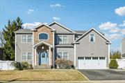 This exquisite 5-bedroom, 3.5-bath center hall colonial, built in 2011, is a true gem waiting to be yours. From the moment you arrive, the meticulously maintained landscaping, charming flagpole, and inviting bluestone walkway set the tone for whatâ€™s inside.Step through the elegant stone-front entrance into a breathtaking 20â€™ cathedral foyer adorned with a crystal chandelier. The open floor plan, boasting 9â€™ ceilings, crown molding, and picture-frame detailing, seamlessly connects the formal living room, a spacious dining room, and an oversized den with a stunning stone fireplace and built-in cabinetry. The heart of the homeâ€”a newly updated gourmet kitchenâ€”features solid wood cabinetry with LED lighting, energy-efficient stainless steel appliances, Caesarstone quartz countertops, and a generous island. Sliding doors lead to a picture-perfect backyard, perfect for entertaining. The main level also includes a versatile guest/office bedroom, a powder room, a laundry room, and built-in surround sound speakers.Upstairs, the expansive ensuite primary bedroom offers a serene retreat with a tray ceiling, sitting area, two walk-in closets, and a beautifully updated spa-like bath with a dual vanity, soaking tub, and glass-enclosed shower. Three additional bedrooms with double closets share a stylish family bath. Every upstairs room is wired with Cat 8 Ethernet for ultimate connectivity.The fully finished lower level is designed for entertainment, featuring built-in cabinetry with a wine and beverage fridge, a stadium-seated home theater with a 98â€ screen and projector, and ample space for a playroom, billiards, or gym. A full bath, two utility rooms with abundant storage, a ductless heat and A/C unit, and baseboard heating add to the comfort. Direct backyard access enhances convenience.Outdoors, your private, resort-like retreat awaits! The fully fenced backyard boasts a heated saltwater in-ground pool with a stone waterfall, lush landscaping with lighting, outdoor surround sound, and a spacious patio ideal for BBQs and gatherings.Located in a beautiful neighborhood with top-rated Massapequa schools, this home offers easy access to the LIRR, public transportation, major parkways, shopping, dining, and more.Donâ€™t miss the opportunity to experience this exceptional home for yourself!