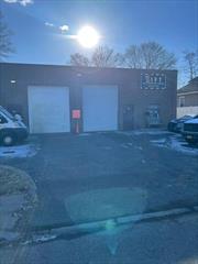 2200 square foot warehouse with 14 feet overhead door, mezzanine, office, 3 parking spaces, 16 foot ceilings.