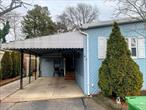 BACK ON MARKET AND PRICE REDUCED THOUSANDS! Double Wide Mobile Home with large living room, separate dining room, kitchen, 2 full baths, laundry room, 3 bedrooms/1set up as office space with sliding glass door leading to step down sunroom with lots of windows and entrance to rear property and shed. carport big enough for 2 cars leading to entrance. NYS star discount eligible buyer to apply. Pet friendly community and Sachem SD! Financing restrictions apply and buyer to be approved by management company