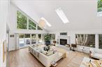Available August and September! Quogue Modern with Pool! 24 Quogue Riverhead Road, a refreshed contemporary with lofty ceilings and an open airy feel is the perfect perch for the extended summer season. With three bedrooms and three baths on two floors, everyone can spread out and find their space. The large great room has seating spaces for large groups and small: a large sectional sits in front of the wood burning fireplace while a cozier seating nook provides a large screen TV. The kitchen is sleek and upgraded with concrete counters and stainless steel appliances. For dining options a table for 8 overlooks the 1/2 acre yard, or take the party poolside with a new grill and teak dining table. There are three bedrooms: a queen bed on the first floor with a nearby full bath. Upstairs is the second bedroom with two twins (or option to combine to a king). The primary suite has a king sized bed and a sleek bathroom with oversized walk-in shower with soaking tub. Skylights throughout bring the sunshine inside (when you&rsquo;re not lounging by the sunny pool). 24 Quogue Riverhead Road is a mile from the beautiful Quogue Wildlife Refuge, 2 Miles from the Quogue Village Shops and 3 miles from the Quogue Village Beach. Renters can obtain passes to access both Quogue&rsquo;s Village Beach and Southampton Town Beaches. Easy access to 27 East and only 80 miles to midtown Manhattan.