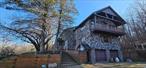 Great Location! This Unique Stone-Sided Contemporary Home Has A Tiled Entryway, An Open Kitchen And Dining Area With A Large Island, And Ample Cabinetry. The Living Room Features A Stone Fireplace, There Is An Office, A Sunny Family Room (Potential Fourth Bedroom), Laundry Facilities, And A Half Bath. The Second Floor Has A Spacious Primary Bedroom With A Walk-In Closet, A Generous Bath With A Jacuzzi Tub, Double Sinks, And A Glass-Enclosed Shower. There&rsquo;s Also An Extra Room For A Sitting Area Or Workspace, Two More Bedrooms, And Another Full Bath. The Basement Includes A Bonus Room, Full Bath, Storage Area, And A Two-Car Garage With Two Wood Stoves For Auxuilary Heat On Those Chilly Winter Nights. Set On Over 14 Acres. The Property Boasts An Inground Swimming Pool (Needing TLC) With A Covered Patio. Lovely Countryside Views Surrounded By Woodsâ€”A Dream Location! This One-of-a-Kind Home Awaits Its Next Owner To Relish The Catskills&rsquo; Solitude And Beauty. Call Today To Schedule Your Private Viewing.