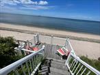 Waterfront! This home was designed for large families. Everyone has their own private space and room plus 3 Living Rooms for games and movies. Now is the time to experience and enjoy this wonderful home! Read on the balcony and see the beautiful Connecticut shoreline in the distance. Spacious hardly defines the space that this home offers. An entertainers dream come true! Great room with island for extra seating when the whole family gathers! Cozy up in front of the gas fireplace for ambiance and warmth on chilly days and nights and relax in the moment. Or head to your own private sandy beach, with a grassy path and deck with access to miles of shoreline for walking, beach combing, fishing, or just floating around in the sound on a hot sunny summer day! This place is a vacation for you and the ones you love!!! Numerous sitting areas to spread out and be together bur not underfoot! Covered porch for dining, rocking chair front porch and sunset viewing deck on the sound all yours!!!! 4 bedrooms, plus nooks and crannies for extended family friends. This home has hardwood floors, an outdoor shower, and offers tri level living space! Come one come all and celebrate summer seaside living here on the North Fork! Visit vineyards, craft breweries, farmstands, and all the east end offers!