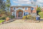 Welcome to this magnificent 6-bedroom, 6-bathroom Central Hall Colonial, perfectly situated on an expansive 60 x 145 lot in the prestigious Jamaica Estates. This move-in-ready masterpiece seamlessly blends classic elegance with modern luxury, offering the perfect retreat for those seeking space, comfort, and sophistication. Step inside to discover sun-drenched, oversized living spaces. The gracious formal living and dining rooms provide an elegant backdrop, while the spacious extra room is ideal for cozy nights in. The gourmet eat-in kitchen is a chefâ€™s dream, featuring high-end stainless steel appliances, custom cabinetry, and generous counter space, perfect for both casual meals and gourmet creations. Each of the six spacious bedrooms boasts its own en-suite bathroom, ensuring ultimate privacy and convenience. The luxurious primary suite is a true sanctuary, complete with a spa-like bath and a generous walk-in closet. Enjoy seamless indoor-outdoor living with a large private deck, perfect for dining al fresco, overlooking the lush, beautifully manicured backyard.Additional Features Include:? Grand entry foyer with soaring ceilings ? Hardwood floors & custom moldings throughout? Expansive windows flooding the home with natural light? Prime locationâ€“ Steps from transportation, shopping, and houses of worship This is a rare opportunity to own a truly spectacular home in one of Queens&rsquo; most desirable neighborhoods.