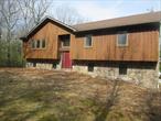Looking for privacy? This 4 Bedroom, 2.5 Bathroom Raised Ranch on 3.87 wooded acres in Town of Fallsburg just might be what you are looking for! Huge kitchen with tons of cabinet & counter space. Main living consists of formal dining room with sliding doors to the rear deck, living room with cathedral ceilings, primary bedroom with full bath & 2 additional bedrooms. Lower level with additional bedroom, bath, office & family room with fireplace. Plenty of parking in your 2 car garage. Close to Route 17, Resorts World Casino, Monticello, Bethel Woods, Yankee Lake, shopping, schools and amenities.