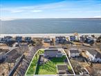 Take In The Beauty Of The Ocean With Immaculate Year-Round Water Views From Nearly Every Room Of The House! This Thoughtfully Designed And Nearly-New Four Bedroom, Three Bath Home Features Two Large Composite Balconies Which Take Full Advantage Of The Picturesque Surroundings. The First Floor Features An Expansive Open Floorplan With Ten Foot Ceilings And Masterfully Equipped Eat-In Kitchen Along With Formal Dining And Living Areas Along With A First Floor Bedroom Or Office! Second Floor Boasts Two Well Sized Bedrooms, Full Bathroom And Access To The First Of Two Balconies Along With A Giant Primary Suite Including Private Balcony And Primary Bathroom With Double Sink Vanity & Huge Glass Shower. Backyard Is Fully Fenced And Includes A Detached Garage.