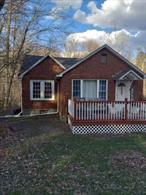 If you want to get a piece of peaceful country living this is a great little home; everything has been recently updated and renovated, granite countertops and Central Air Conditioning and has a blacktop driveway. Walk out to a big back deck which leads down to your private fenced in backyard with a 8x12&rsquo; shed. To add to the charm you have your own little brook that runs thru the property