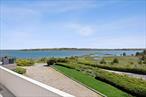 A rare opportunity to own a stunning waterfront retreat with breathtaking views, a heated pool, and a private tennis court in the heart of Southampton. Perfectly positioned on an acre overlooking Cold Spring Pond and Peconic Bay, this contemporary home is designed to maximize natural light, sweeping vistas, and seamless indoor-outdoor living.Custom windows bathe the open-concept living and dining areas in sunlight that shifts beautifully throughout the day, creating a serene and inviting atmosphere. Expansive balconies wrap around the home, offering multiple vantage points to take in the tranquil water views and abundant wildlife&#226;â‚¬â€keep your binoculars handy for birdwatching.With four bedrooms, three bathrooms, and an additional family room, there is ample space for relaxation and entertaining. Outside, the oversized deck surrounds a heated pool, providing the perfect setting for summer gatherings. The property also boasts a newly painted tennis court and a detached two-car garage with a second-story storage loft.Just minutes from pristine ocean beaches and Southampton Village, this exceptional home offers the best of waterfront living, nature, and convenience. Do not miss the chance to make it yours.