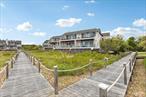 Just listed , renovated and Large two bedroom, two bath condominium situated on Fort Pond Bay with the most beautiful sunsets. This gated thirty-acre community offers many amenities which include a 32 x 70 heated gunite pool, Jacuzzi, sauna and 5 tennis courts. Enjoy relaxing on the bay beach with a 1, 075 ft. fishing pier with gazebo. Grab a bite at Navy Beach Restaurant on adjacent beach or Montauk Project Restaurant across the way. Enjoy water sports including kayaking, paddle boarding or sailing along with barbecues, picnic tables for those summer gatherings. To end the day with beautiful sunsets and great music at Surf Lodge just down the street. Reach out to tour this large sought after TWO BEDROOM TWO BATH home within the community.