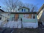 Diamond in the rough. This one needs a complete renovation but will be well worth the effort. Living room, Dining room, Kitchen, enclosed porch, 2 bedrooms and a bath on the main level. 2nd floor has 2 more rooms and the basement offers potential for additional space as well. Just over the Bronx border making it close to the Dyre Ave train stop and E 233rd St buses.