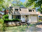 Charming home located in the quaint beach front community of Wading River Shores. Exclusive neighborhood of 48 homes with private deeded beach rights on the LI Sound. Located in the sought after school district of Shoreham Wading River this home is ideal for year round living or a summer retreat. The well maintained home has unique touches throughout. The free form wrap around deck,  accessible from the dining room or mud room is perfect for family gatherings. Upgraded large hardwood windows keep the home bright and airy. Hardwood floors, solid wood doors, vaulted ceilings and exposed beams provide natural beauty. Wood burning fireplace nestled between display cases provide a subtle architectural element. Cherry wood kitchen cabinets and a spacious pantry allow for plenty of storage.