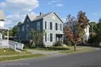 Investment opportunity in vibrant midtown Kingston! This well-maintained two-family home is bathed in natural light and freshly painted inside and out. It features refinished hardwood floors, new fixtures, and updated kitchens with new sinks and countertops. The first-floor unit offers three spacious bedrooms, while the second floor has two. The upstairs bathroom boasts a whirlpool tub, stand-up shower, and new sink. Both units now have brand-new INSTICT combi boilers with separate propane tanks, ensuring each tenant covers their own heating costs. The clean, empty basement houses a washer and dryer, providing additional storage. A brand-new main sewer line to the street ensures reliable plumbing. Outside, a covered area connects an oversized garage and a large shed/workshop, offering ample space for storage or projects. With a massive two-car garage and a double-wide driveway, thereâ€™s plenty of space for up to six cars to park. Don&rsquo;t miss this fantastic investment opportunity in Kingstonâ€™s thriving midtown neighborhood!