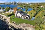 Welcome to Four Seasons waterfront living! Introducing this brand-new Malibu-cool stunner beautifully situated atop a private peninsula overlooking Long Island Sound and backing onto the tranquil waters of Premium Mill Pond. This Architectural Digest-quality home is the creme de la creme of an exclusive guard-gated community thatâ€™s just 35 minutes from NYC in the town of Mamaroneck. Such an opportunity is once in a lifetime - a spectacular 1.3-acre seaside sanctuary with 360-degree water views, neighborhood beach and boat slips, plus a magnificent entertainerâ€™s patio and covered outdoor kitchen with pool and hot-tub to be built. Every inch of this 8-bed, 10.3 bath home is sparkling new unparalleled luxury, laid out over four floors with elevator service. A masterpiece of design, it boasts walls of glass for a panorama of pure uninterrupted bliss from sunrise to sunset. Each space is breathtaking â€“ from the dramatic open concept family and living rooms to the sensational kitchen with two islands, adjacent butlerâ€™s pantry/wet-bar and seriously stylish dining room. A serene office also doubles as a 1st-floor ensuite bedroom. The primary suite dazzles with never-ending water views, spa bathroom and 2 walk-in closets. Thereâ€™s a fabulous upstairs rec room, 3 laundries, mudroom, wine room, sprawling custom gym and 3-car heated & cooled garage. Simply one-of-a-kind!