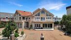 This 7200sq. ft. Spectacular Waterfront home is located at the end of Arbutus Avenue past Nicolosi Drive in the heart of S.E Annadale. This magnificent, Contemporary estate with colonial design has Panoramic Ocean views from virtually every room making this home utterly surreal. This home features 11 rooms, two staircases, a residential dumb waiter elevator, fantastic entertainment plan, 2 living rooms and 2 family rooms. The grounds are approx. 11, 000 square feet and include a heated in-ground pool with spill over Hot-tub. Outdoor kitchen, bar, firepit, built in BBQ, fridge. Level 1 has a grand foyer, formal dining room, media room, family room, butler&rsquo;s pantry, wet bar, eat-in kitchen with sliders to heated sun porch, activity room, living room & bathroom. Level 2 has the master bedroom suite, with sitting space, an ocean view balcony, full Roman bath with his and hers sinks, and a two walk-in closets. The ground floor has two sides. One side has a full bath, washer and dryer and open space used for entertainment. The other side has 2 bedrooms, living room and a full bath. Home features Viking appliances, granite kitchen, island, all custom moldings, ocean view from 2 floors and loft. loft in 2 of bedrooms, maids&rsquo; quarters which has 2nd granite kitchen, living room, family room, ceiling fan in every bedroom, fireplace in family room and bedroom. surround speakers throughout entire house. security cameras throughout. ocean view from 2 balconies. Master suite with w separate shower, jacuzzi tub, walk in closet, 3 Furnaces, Third floor loft. 7 zone central air, cast iron hot water and radiant heat, vaulted ceilings, crown moldings and recessed lighting throughout. Generac Generator for entire home. Slate roofing. Maintenance free Cambridge pavers around home. 3 car garage with lift accessible. Flood ins only 700, Taxes 12000 Next door to castle on end of Arbutus Ave after, Buyer pays transfer tax.