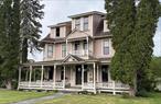 Sited on the most prestigious block in Catskill, NY, with panoramic views of the Hudson River, Rip Van Winkle Bridge and Frederick Church&rsquo;s Olana, you will find Judge Emory Chase&rsquo;s Victorian home that has proudly stood since the 1880s. This gilded age home has entertained a U.S. President, astronaut, several judges and the double parlor once held the wedding reception of Chase&rsquo;s daughter! This 9 bedroom, 3.5 bath home has been meticulously restored to retain many original details that simply cannot be reproduced today: hand carved woodwork and a stunning banister that rises up three floors thru the center hallway, plaster crown moldings, fireplaces, wide plank wood floors, pocket doors and high ceilings. The office with the original wall of built-in bookcases adds to the character of the house. The new gourmet kitchen with an entire wall of windows/doors floods the space with tons of natural light and flows seamlessly outside to a large deck/backyard for entertaining on a scale few can imagine. The entire front of the house has a long &rsquo;rocking chair&rsquo; porch perfect for taking in the beauty of this historic neighborhood. The second floor balcony provides a serene perch for viewing stunning river views, morning sunrises or maybe an afternoon nap. Behind the house you&rsquo;ll find a large fenced in yard (plenty of room for a flower/vegetable garden and pool), a two story carriage house with endless possibilities and for convenience there&rsquo;s a separate service entrance off of Bridge St. that leads directly to the yard. The house while currently set up as a single family home could easily be a spectacular B&B (some town rules would apply). The double parlor, dining room, deck and backyard make perfect common areas for such a venture. In addition, the massive two story carriage house could potentially offer small events sponsored by the inn or maybe even the local community. While the near by city of Hudson currently has several such inns Catskill does not, so it would be a nice addition to the village. Just a short stroll down the hill to Catskill&rsquo;s Main St. that offers amazing restaurants, breweries, shops, Foreland Art Complex, an old nostalgic movie theater, marina and public park right on the Hudson River/Catskill Creek. The property is book-ended by the village owned Beattie-Powers House and a NY State hiking trail - both leading down to the river&rsquo;s shoreline. Hudson&rsquo;s Amtrak; 10 mins, Windham/Hunter Resorts; 30 mins, Bard College; 25 mins, NY Thruway; 10 mins and NYC only 2 hrs.