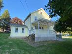 Investment opportunity! Two Story house with three bedrooms, one and half bathrooms, two mobile homes with two bedrooms each. All units are fully rented. There is also a three car detached garage.