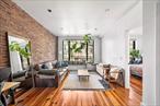 Welcome to this charming condo with unique character and modern amenities! Featuring beautiful exposed brick and beams, hardwood floors, and an open floorplan that offers great natural sunlight from large windows. The space includes a convenient breakfast bar, perfect for casual dining. Enjoy outdoor living on the rooftop patio, and benefit from additional storage space in the basement. Located just minutes away from the L train, McCarren Park, and a variety of cafes and dining options along Graham and Metropolitan Avenues.