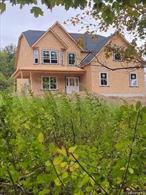 New construction colonial being built in Round Hill Estate,  a picturesque 6-lot subdivision nestled in the charming town of Warwick. This serene community boasts rolling fields and a tranquil atmosphere, while still being a short drive away to the village with unique shops, restaurants, and services that add to the charm of this quaint community. The Harper model features 4 bedrooms, 3 full baths, first floor bedroom and first floor office, grand two story living room with fireplace, gleaming hard wood floors through out and plush new wall to wall carpet in all bedrooms. Beautiful custom kitchen complete with tiled back splash, center island and dinette with sliders leading out to back deck. Retreat to the primary bedroom with spacious walk in closet, sitting room and private master bathroom with double vanity, tiled shower and soaking tub. Full unfinished basement and 2 car garage included.