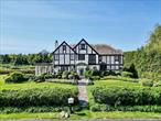 This enchanting 1920s Colonial home, set on over half an acre of picturesque pond-front property, is a perfect blend of timeless elegance and modern living. With its classic architecture, open floor plan, and serene natural setting, this residence offers a unique and inviting lifestyle. A spacious living room with large windows that offer views of the pond, allowing natural light to fill the space. The formal dining room, with its elegant details and ample space, is perfect for hosting dinner parties and family gatherings. The master suite includes an en-suite bathroom and generous closet space. 4 Additional bedrooms are perfect for family members or guests. The large backyard is perfect for outdoor entertaining, gardening, or simply relaxing by the water all in the prestigious gated community of Kennilworth with its own security and waterfront pool.