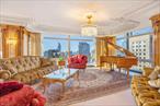 Magnificent 63rd-Floor Gem in Trump Tower on Fifth AvenuePerched high above the city on the 63rd floor, this extraordinary three-bedroom, three-and-a-half-bathroom residence is a masterpiece of design and craftsmanship. Every inch of this home has been meticulously curated, from the intricate crown molding and rich wood paneling to the exquisite flooring and breathtaking bathrooms designed by Kenneth Bordewick of Beverly Hills.Each bathroom is a work of art in its own rightâ€”one is enveloped in alabaster, another features rare amethyst sourced from Tanzania, while the others showcase stunning onyx and lapis lazuli, creating a one-of-a-kind living experience. Adding to the grandeur, stunning Baccarat chandeliers illuminate the space, casting a warm, opulent glow that enhances the homeâ€™s timeless elegance.Beyond the residence, Trump Tower offers an unparalleled suite of amenities, providing the ultimate luxury lifestyle. Residents enjoy 24-hour valet service, a dedicated concierge, and a full-time doorman, ensuring seamless service at all times. The world-class fitness facility allows for wellness and relaxation, while maid service is available for added convenience. The building also features an exclusive lounge, the iconic Trump Bar, and upscale dining at Trump Grill. Beautifully designed interconnecting landscaped walkways, a serene garden, and a private courtyard offer a rare oasis in the heart of the city.