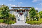 Presenting one of Saltaireâ€™s premiere homesâ€”206 Broadway, a true masterpiece that combines luxury, craftsmanship, and a prime central location in the heart of this exclusive Fire Island community. Custom-built by the owner, a skilled contractor, this expansive 5-bedroom, 3.5-bathroom year-round residence offers the perfect blend of comfort, style, and functionality. Situated on a 6-lot parcel offering a spacious private retreat, this home is equidistant from the bay beach, and main ocean beach, making it an ideal destination for beach lovers and year-round residents alike.Spanning a generous 3, 050 SF of living space, this home is designed to impress. Featuring 5 bedrooms, including an ensuite primary bedroom with a luxurious bath featuring custom built in cabinetry, as well as an ensuite guest bedroom with its own 2nd-floor deck. The three additional newly renovated bedrooms provide ample space for guests. The home also includes a dedicated office, a summer/winter use screened porch with its own heat and A/C and an outdoor kitchenâ€”ideal for entertaining.The gourmet chefâ€™s kitchen, specifically designed with culinary enthusiasts in mind, features top-of-the-line Subzero and Wolf appliances, reclaimed Antique Heart Pine countertops, and radiant heat floors for added warmth and comfort. A nearby outdoor shed/pantry provides extra storage with a refrigerator and commercial freezer. The expansive living and dining area is highlighted by a wood-burning fireplace, built-in cabinetry, and new wood floorsâ€”creating an inviting atmosphere perfect for both everyday living and entertaining.The spa-like primary bedroomâ€™s ensuite bath is a true retreat, offering built-in custom cabinetry, a â€˜Kohlerâ€™ smart toilet, a soaking tub, a digital shower system, two towel warmers, and radiant heated floors. Every detail has been meticulously curated to offer the highest level of comfort and style.For outdoor enjoyment, the large main deck features an outdoor kitchen with â€˜Lynxâ€™ appliances, â€˜Quartziteâ€™ countertops, and a wood trellis covering, creating the perfect space for dining and relaxation. The deck also boasts built-in and freestanding herb/flower planters, Sonos speakers, and a large shade canopyâ€”ideal for soaking in the natural surroundings. Letâ€™s not forget the 1800 SQ FT above ground basement, the perfect place for a home gym or game room.This exceptional home is perfect for both large and small gatherings, offering seamless indoor-outdoor living that embodies the best of beach town luxury. Saltaireâ€™s vibrant community provides access to a yacht club, tennis courts, sailing, and much more, making it a truly sought-after destination. Offered fully turnkey, 206 Broadway is your opportunity to own a one-of-a-kind residence in one of the most desirable locations on Fire Island.