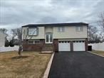 Spectacular Hi Ranch in desired West Islip SD Beautifully renovated 5 + bedroom home...New Baths and Kitchen, floors , walls/paint, CAC, doors,  roof, driveway, custom railings,  SO MUCH MORE !!!Very workable In-Law Suite. Great family layout. All access to huge fenced yard with Sun deck overlooking grassy peaceful surroundings .  Ready to see you and your family...