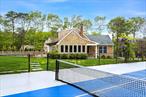 Located in Quogue, this beautiful home sits at the end of a long driveway, past your all-weather tennis court. The property features 4 bedrooms and 3 bathrooms, all situated on over 2 acres. Inside, you&rsquo;ll find a welcoming area, a kitchen, and a living room with a wood-burning fireplace and vaulted ceiling. The first floor includes a primary suite and a guest bedroom, in addition there is another bath with laundry while the upper level has two generously sized bedrooms that share a bathroom. Additionally, there&rsquo;s a finishable basement with its own exterior entrance. Open the sliding doors from the dining area to access your deck, which surrounds the inground pool and overlooks the tennis court, completing this stunning package. Outside, as you gaze over the expansive lawn, you&rsquo;ll see endless possibilities. Enjoy the benefits of Quogue taxes, and access to Quogue beaches (just 2.5 miles away).Access from 145 Montauk Highway