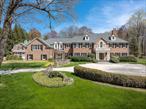 Set on a serene, level 4.15-acre lot and perfectly sited for privacy, exceptional 6 bed, 6.2 bath, center-hall Georgian Colonial with a charming guest house offers the ultimate in luxury living. A harmonious blend of classic architecture and modern updates, this meticulously maintained residence is turnkey and move-in ready. The elegant, front-to-back foyer welcomes you into beautifully scaled formal spaces including a dining room, living room, and private den/office. A spacious family room, framed by French doors leading to tranquil bluestone patios, connects seamlessly to the gourmet kitchen with a Wolf gas range, Sub-Zero refrigerator, two additional refrigerator/freezer drawers, dual dishwashers, a center island, and a sunlit dining area. The main level also features a versatile ensuite bedroom, ideal for guests, a second office, or a playroom. Upstairs, the luxurious primary suite includes a tray ceiling, dual walk-in closets, a spa-like bath, and an adjoining private sitting room. Three additional ensuite bedrooms offer generous space with custom built-ins and walk-in closets. A spectacular second floor family room with cathedral ceilings and close proximity to the 6th bedroom, also provides an ideal private suite for guests or extended family. The finished lower level adds approximately 1, 400 square feet and features a playroom with custom mahogany wet bar, gym, and half bath. A separate one-bedroom guest house with a covered porch and oversized two-car garage adds flexibility for guests, a studio, or home office. Recent updates include conversion to natural gas, a new roof, spray foam insulation, and energy-efficient windows. The seven-bedroom septic system is strategically located in the front, leaving the expansive backyard open to limitless potential. Enjoy proximity to public and private schools, downtown Greenwich, and the Merritt Parkway. With classic sophistication, modern comforts, and exceptional privacy, this one-of-a-kind property truly feels like home. Note: Square footage on the field card does not include -1, 400 sq. ft. of finished lower level or -2, 033 sq. ft. of garage space.