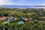 Tucked away on a lush, one-acre lot in Shinnecock Hills, this exquisite 6-bedroom, 7.5-bath estate epitomizes luxury living just moments from Southampton Village and the vibrant offerings of Hampton Bays. Surrounded by beautiful Ocean and Bay beaches, the outdoor space is an entertainerâ€™s dream, featuring a heated saltwater gunite pool and a sprawling bluestone patioâ€”ideal for relaxing in the sun or hosting unforgettable gatherings. Inside, elegance and functionality combine effortlessly, with high-end finishes throughout and an immersive stay-at-home experience. The main floor provides a seamless flow between indoor and outdoor living, including two additional spacious bedroom suites and stunning glass doors that open directly to the pool and patio, offering the best of both worlds. The second floor offers two private bedroom suites, each with an ensuite bathroom, walk-in closets, and balconies, enhancing the resort-style experience with an added touch of luxury. The lower level impresses with two more elegant bedroom suites, a private gym, steam shower, movie theater, wine cellar, and laundry room. This exceptional property blends contemporary style, timeless sophistication, and coastal allureâ€”a true treasure in the heart of the Hamptons, with easy access to world-class dining, marinas, and beaches.