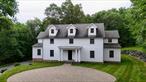 True custom colonial at the end of a private cul de sac, this builders personal home is filled with unique and desirable upgrades and touches throughout. Grand entry welcomes you with cathedral ceilings and double staircase. 10&rsquo;+ ceilings and 4 black oak floors throughout the first floor. Double doors welcome you into a sitting room with roughed in plumbing for a wet bar. Chef&rsquo;s kitchen will leave you wanting for nothing: built in glass front cabinet, custom concrete counters, vaulted ceilings with skylights, 6 burner Dacor range with double oven, 2 full sized Summit refrigerators, 2 pantries, and pocket doors. Large family room has massive windows that overlook the yard and surrounding woods and a wood burning fireplace. Large private office and game room complete the first floor. Up the double staircase, the primary wing offers a sitting room, bedroom with vaulted ceilings and private balcony. Walk through the custom closet into the primary en suite with 2 separate sinks, soaking tub, large shower, water closet, and radiant heat floors. Walk past the large convenient 2nd floor laundry to the opposite wing of the second floor which has the remaining bedrooms and bathrooms. The Jack and Jill bath with double sinks joins 2 bedrooms each with walk in closets. The remaining bedroom has 2 generous closets, and the hall bath has radiant heated floors. Very oversized, extra long 2 car garage had radiant heated floors and a built in power washer. Unfinished daylight basement has many possibilities with 10&rsquo; ceiling clearance and is already equipped with heat and AC. Back yard is partially wooded and abuts PDR land, providing privacy and scenery. Take it all in from the covered bluestone patio or from around the firepit.