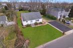 Welcome to this charming expanded Cape house in Massapequa, nestled on a spacious lot! This home features a modern concept living room, a spacious formal dining room, and a beautiful eat-in kitchen with stainless steel appliances and soft-close cabinets. With four well-crafted bedrooms and two full baths, there&rsquo;s ample space to meet your family&rsquo;s needs. Hardwood floors and recessed lighting throughout add an elegant touch to every room.Located in a prime area, you&rsquo;ll find convenience in every direction, from schools to parks, shops, and public transportation. The fully finished basement provides additional living space. Outside, enjoy the lush green fenced backyard, perfect for quality time with loved ones. With a private driveway, parking, and street parking available, this house has plenty of potential. Don&rsquo;t miss out on this dream home-it could be yours!, Additional information: Appearance:Mint++
