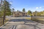 Welcome to this gated and updated 5000 sqft center hall colonial!Step inside to find well maintained hardwood floors that flow seamlessly setting a warm tone.The spacious layout includes a large formal living room, formal dining room, updated EIK and den with fireplace.Plus a bonus living room and bedroom suite on main level.Do not miss the primary bedroom with fireplace and it&rsquo;s own balcony overlooking expansive backyard featuring a sparkling pool, pavers, deck..perfect for entertaining and relaxation! This is an exceptional property that combines best of both indoor and outdoor living.Also includes a finished basement for a home office or recreational space. Tennis ct as is! Half Hollow Schools.