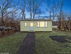 Come see this charming two-bedroom, one-bathroom cottage that sits along the Esopus Creek, blending rustic charm with modern comfort. The cozy interior features luxury vinyl floors, and plenty of windows creating a warm, inviting atmosphere. The kitchen is compact yet functional, with modern appliances. Bedrooms are simple but cozy. The bathroom is thoughtfully designed with natural stone accents. Outside provides a perfect spot for relaxing and enjoying the sounds of the creek. This cottage offers a serene, tranquil retreat in a beautiful natural setting. This is a Fannie Mae Homepath property.