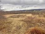 Gorgeous, mostly level meadow, waiting for your dream Home / Farm. With lots of road frontage and two small picturesque man made ponds. There are two signs marking the main parcel starting points. Residential (R4), 4 acre zoning.